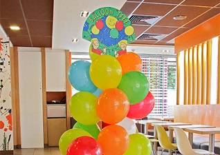 Balloon Tree™ Stand in McDonald’s fast food restaurant with multi-coloured balloons