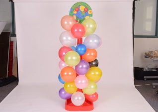 Balloon Tree™ Stand in red with multi-coloured balloons on white background