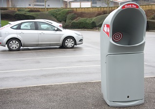 Combo Delta™ Large Aperture Litter Bin in grey sited at service station car park for drive-thru waste disposal