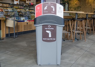 Eco Nexus® Cup Recycling Station in a coffee shop with compartments for lids, cups, liquids and general waste