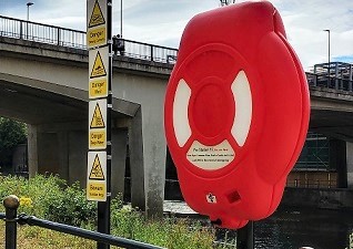 Guardian™ Lifebuoy Housing with SOLAS approved lifebuoy, rail-mounted on the roadside