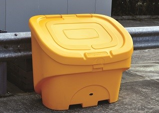Nestor™ 400 Litre Lockable Grit Salt Storage bin in yellow in a car park