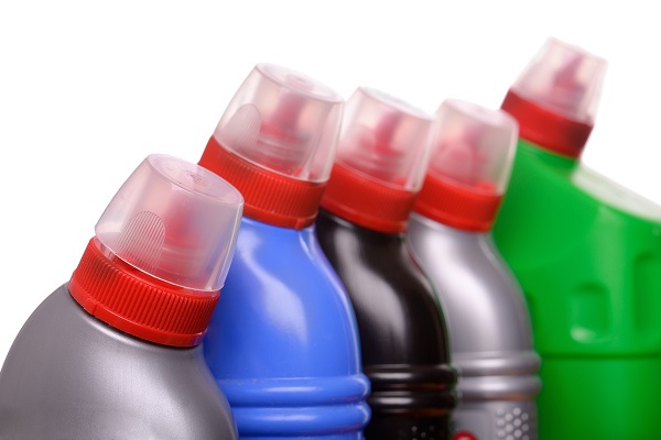 A selection of household cleaner products and plastic bottles
