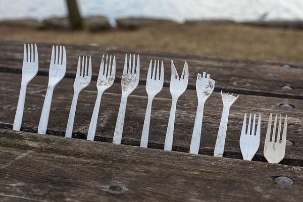 Single-use plastic forks on decking