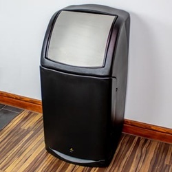 combo catering waste bin with a flap aperture in a modern building