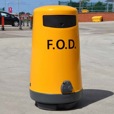 yellow FOD 90 bin on pavement