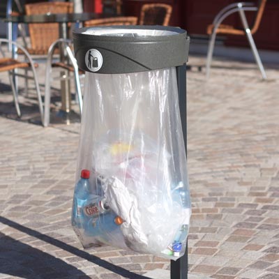 orbis transparent sack holder bin near some seating outside