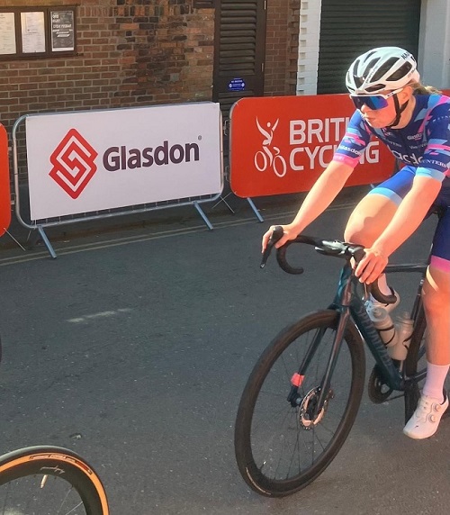 cyclist next to glasdon logo