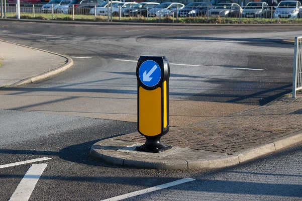 A Solar Signmaster in illuminating hazards near a parking lot