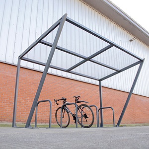 Strada Cycle Shelter with bicycle locked up against stand