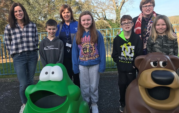 A group of children and KCA members stood next to TidyBear and Froggo Litter Bins
