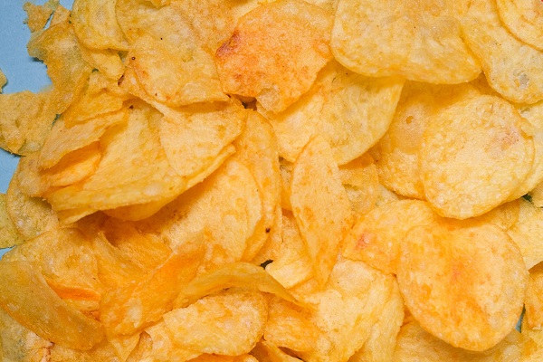 A pile of crisps spread out on a surface