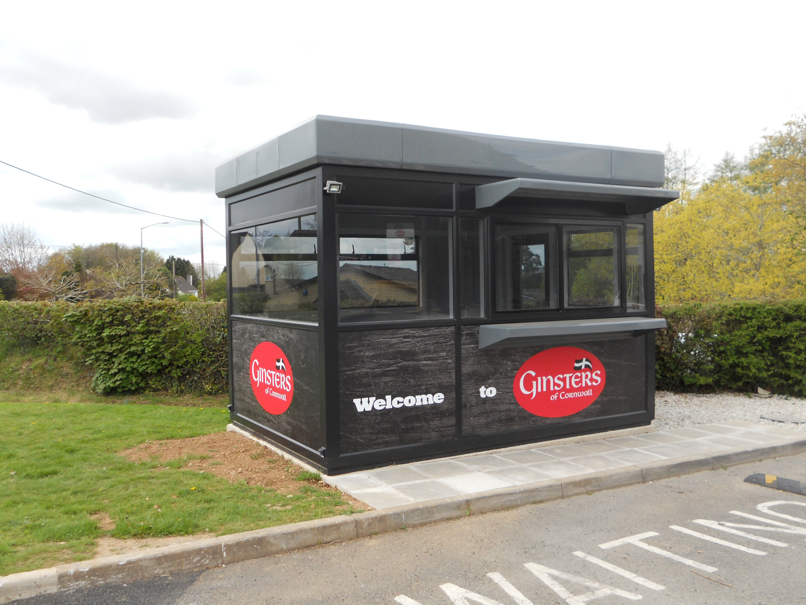 Warrior™ Contemporary Modular Steel Building with front and side graphics
